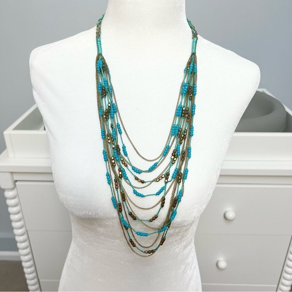 Turquoise and gold tone beaded multistrand necklace